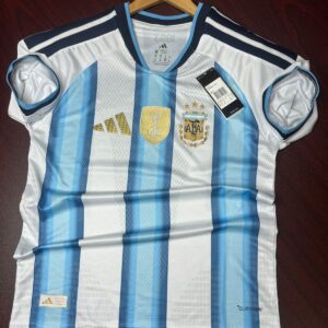 Argentina World Cup 2026 home jersey with sky blue and white stripes in player edition design. Close-up view of Argentina premium football jersey showing breathable lightweight fabric and heat press logo. Messi 10 Argentina home jersey with slim fit player edition style and modern athletic look. Argentina football jersey mockup featuring premium recycled polyester material and official-inspired design.